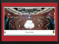 Picture: This 13.5 X 40 panorama of the Chicago Blackhawks during the team's Western Conference Quarterfinals series, clinching Game 5, with a win over the Minnesota Wild has been professionally double matted in team colors and framed to 18 X 44. The Blackhawks captured the 2013 Presidents' Trophy after posting a National Hockey League leading 77 points during the regular season. Chicago's fifth consecutive Stanley Cup Playoffs berth started with a five-game series win over the Wild. The Blackhawks' 5-1 victory in Game 5 was witnessed by 21,597 fans at the United Center, marking the franchise's 217th consecutive capacity crowd dating back to 2008.