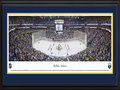 Picture: This 13.5 X 40 panorama of the First Niagara Center has been professionally double matted in team colors and framed. It spotlights a thrilling night of ice hockey as the Buffalo Sabres kicked off their season on home ice. Their unique moniker, chosen by a “name the team” contest, was selected to reflect a weapon carried by a leader, one that can be used effectively in both an offensive and defensive moment, much like the necessary components of a successful hockey club. The Buffalo, New York team has undergone many transitions since their inception into the National Hockey League in 1970. Personnel and ownership movement has been reflected in changes to the logo and team colors, which today is a stylized bison atop two crossed sabres in blue, white and gold.