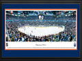 Picture: This 13.5 X 40 panorama has been professionally double matted in Edmonton Oilers team colors and framed to 18 X 44. It brings to focus the Edmonton Oilers playing on home ice. The Oilers, based in Edmonton, the capital of the Canadian province of Alberta, had their team name inspired by Alberta's vast oil reserves. A group of talented players were introduced to the NHL when the Oilers joined the league in 1979. After winning multiple Stanley Cup Championships during the 1980s, the Oilers were honored with "dynasty" status by the Hockey Hall of Fame. In the 1983-84 season, the Oilers finished first overall in the National Hockey League winning a franchise record of 57 games and scoring a grand total of 446 goals for an NHL record.