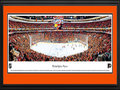 Picture: This 13.5 X 40 panorama features the Philadelphia Flyers playing on home ice at the Wells Fargo Center to a capacity crowd and has been professionally double matted in team colors and framed to 18 X 44. The Flyers were established in 1967 as part of the National Hockey League expansion and went on to complete their inaugural season by finishing atop all expansion teams in their division. In the 1973-74 season, the Flyers were the first team to win the Stanley Cup that were not part of the Original Six teams. The Flyers began the 1979-80 season by going undefeated for a North American professional sports record 35 straight games (25–0–10). The Flyers have played their home games on Broad Street since their inception, and are well know as the Broad Street Bullies.