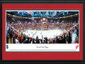 Picture: This 13.5 X 40 panorama of the Detroit Red Wings in the opening game of the 2011 Stanley Cup Playoffs has been professionally double matted in team colors and framed to 18 X 44. This contest marked the Red Wings 20th consecutive season in the playoffs. One of the Original Six teams of the National Hockey League, the Red Wings were established in 1926. Winning their first Stanley Cup Championship in 1936, they repeated the feat the following year, becoming the first American team to win consecutive Stanley Cup Championships. As of 2011, the Red Wings have won more Stanley Cup Championships than any other NHL franchise based in the United States.