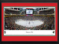 Picture: This 13.5 X 40 panorama captures the action of the Minnesota Wild playing on home ice to a capacity crowd at Xcel Energy Center and has been professionally double matted in team colors and framed to 18 X 44. On June 25, 1997, the National Hockey League announced that Minnesota had been awarded an expansion franchise to begin play in the 2000-2001 season. The club name, the result of a fan write-in campaign, reflects Minnesota’s natural beauty and wildlife. The Wild crest is a pictogram that depicts both the Minnesota Wilderness and the silhouette of a wild animal. Among the components hidden in the logo are the North Star, evergreen trees, a red sky, the sun and/or moon and a stream. The organization retired sweater number 1, as a tribute to Wild Fans, on October 11, 2000.