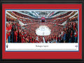 Picture: This 13.5 X 40 panorama of the Verizon Center has been professionally double matted in Washington Capitals team colors and framed to 18 X 44. It spotlights the Washington Capitals in Game 2, as they defeat the New York Rangers 1-0 in overtime, to take a 2-0 series lead in the National Hockey League Eastern Conference Quarterfinal series. The Capitals held firm when they were a man down, then went on to make the winning goal in overtime. A razor-thin margin in the playoffs between these teams is typical, as five of their seven games in the last year's postseason were decided by one goal, including three games that went into overtime play. This is the third consecutive season that the Rangers have faced the Capitals in the playoffs, and the fourth time in the past five seasons.