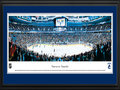 Picture: This 13.5 X 40 panorama of the Rogers Arena has been professionally double matted in Vancouver Canucks team colors and framed to 18 X 44. It captures the Vancouver Canucks in mid-game action. Vancouver's hockey roots go deep beginning with their first professional team in 1911, the Vancouver Millionaires, followed by a number of minor league teams before the Canucks joined the National Hockey League as an expansion team in 1970. The Canucks history includes advancement to the Stanley Cup Final, numerous division titles and a Presidents' Trophy. On March 27, 2011, the team recorded its 50th victory of the season for the first time in franchise history.