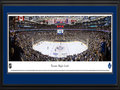 Picture: This 13.5 X 40 panorama of the Air Canada Centre has been professionally double matted in Toronto Maple Leafs team colors and framed to 18 X 44. It captures one of the most physical rivalries in the National Hockey League, a tradition that occurs four times a season, as the Toronto Maple Leafs face off against the Philadelphia Flyers. The Toronto franchise was established in 1917 and has been one of the most popular teams in the NHL. They have captured over a dozen Stanley Cup Championships and sent more players to the Hall of Fame than any other team. The club is one of the Original Six members of the NHL and was renamed the Maple Leafs on Valentine's Day 1927. The Air Canada Centre opened in 1999; that season the Maple Leafs defeated the Philadelphia Flyers in the first Playoff series ever staged in their new home.