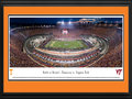 Picture: Just out from September 10, 2016! 13.5 X 40 panoramic poster of the "Battle at Bristol" between the Tennessee Volunteers and Virginia Tech Hokies professionally double matted and custom framed to 18 X 44. This panorama at Bristol Motor Speedway spotlights college football’s largest ever event, the Battle at Bristol, between the Volunteers from the University of Tennessee and the Hokies from Virginia Tech. BMS transformed its iconic short track into a world-class football stadium for this inaugural event. The matchup between these two regional powerhouses, in combination with the special venue, drew an all-time record crowd for a college football game. The game was played on the infield of the speedway, which ranks as the fourth-largest sports venue in America and possesses enough seats for approximately 160,000 people.