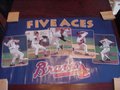 Picture: This is an original and ultra rare poster from the defunct Norman James Company that is almost impossible to find and is almost a quarter of a century old. This is the iconic "Five Aces" Poster with John Smoltz, Tom Glavine, Greg Maddux, Steve Avery and Kent Merker on it. 22 X 34 poster in excellent shape with no pin holes or tears and never used. Taken out of the factory seal for this picture, the very top left corner has miniscule wear on solid blue not touching image area from years of tightness in seal but the rest is absolutely pristine. Not seen if framed! Hard to find this poster at all, but nearly impossible to find it in this great of condition because this is one everyone took out and hung on their wall!