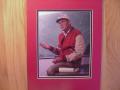 Picture: Alabama Crimson Tide Bear Bryant 8 X 10  photo professionally double matted to 11 X 14 so that it fits a standard frame. A great football picture of Bear teaching football with a chalkboard in the background, notes at his side, and old-time film!