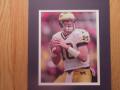 Picture: Tom Brady Michigan Wolverines original 8 X 10 photo professionally double matted in Maze and Blue to 11 X 14 so that it fits a standard frame.