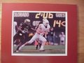 Picture: Colt McCoy Texas Longhorns against Colorado 8 X 10 photo professionally double matted in team colors to 11 X 14 so that it fits a standard frame.