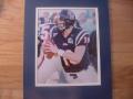 Picture: Eli Manning in blue uniform Ole Miss Rebels 8 X 10 photo double matted to 11 X 14 so that it fits a standard frame.