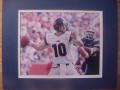 Picture: Eli Manning Ole Miss Rebels vs. Florida 8 X 10 photo double matted to 11 X 14 so that it fits a standard frame.