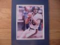 Picture: Eli Manning in white uniform Ole Miss Rebels 8 X 10 photo double matted to 11 X 14 so that it fits a standard frame.