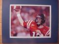 Picture: Eli Manning in red uniform Ole Miss Rebels 8 X 10 photo double matted to 11 X 14 so that it fits a standard frame.