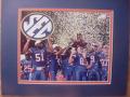 Picture: Florida Gators 2008 SEC Championship players 8 X 10 photo professionally double matted in team colors to 11 X 14 so that it fits a standard frame.