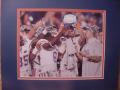 Picture: Florida Gators 2009 BCS Championship Players with Trophy 8 X 10 photo professionally double matted in team colors to 11 X 14 so that it fits a standard frame.