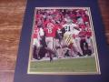 Picture: Calvin Johnson of the Georgia Tech Yellow Jackets beats Georgia's Paul Oliver original 8 X 10 photo professionally double matted in team colors to 11 X 14 so that it fits a standard frame.