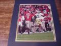 Picture: Calvin Johnson of the Georgia Tech Yellow Jackets beats Georgia's Paul Oliver original 8 X 10 photo professionally double matted in team colors to 11 X 14 so that it fits a standard frame.