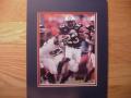 Picture: Kenny Irons Auburn Tigers original 8 X 10 photo professionally double matted in team colors to 11 X 14 so that it fits a standard frame you can find easily and purchase inexpensively.