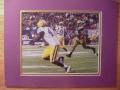 Picture: Jordan Jefferson to Quinn Johnson LSU Tigers original 8 X 10 photo professionally double matted to 11 X 14 so that it fits a standard frame.