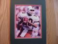 Picture: Bernie Kosar Miami Hurricanes original 8 X 10 photo professionally double matted to 11 X 14 to fit a standard frame.