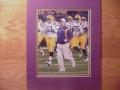 Picture: Les Miles and his LSU Tigers players run onto the field original 8 X 10 photo professionally double matted to 11 X 14 so it fits a standard frame.