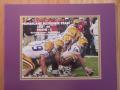 Picture: LSU Tigers "Hurricane Response Team" original 8 X 10 photo professionally double matted to 11 X 14 to fit a standard frame. Has score and date of game on it.