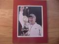 Picture: Mack Brown Texas Longhorns 8 X 10 photo double matted to 11 X 14 so that it fits a standard frame. This photo shows Brown with the 2009 Tostitos Fiesta Bowl Championship Trophy.