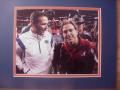Picture: Urban Meyer and Nick Saban gather after the Florida Gators win the 2008 SEC Championship original 8 X 10 photo professionally double matted in Gator colors to 11 X 14.