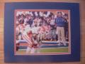 Picture: Urban Meyer watches his Florida Gators players 8 X 10 photo professionally double matted in team colors to 11 X 14 so that it fits a standard frame.