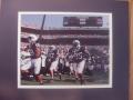 Picture: Penn State Nittany Lions players run on the field at Beaver Stadium in College Station, Pennsylvania 8 X 10 photo professionally double matted to 11 X 14 so that it fits a standard frame.