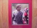 Picture: Nick Saban runs an Alabama Crimson Tide practice original 8 X 10 photo professionally double matted to 11 X 14 so that it fits a standard frame.