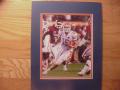 Picture: Tim Tebow leads the Florida Gators against Oklahoma in the 2009 BCS National Championship Game 8 X 10 photo professionally double matted in team colors to 11 X 14 so that it fits a standard frame.