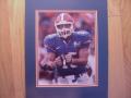 Picture: Tim Tebow "Up Close and Personal" Florida Gators 8 X 10 photo professionally double matted to 11 X 14 so that it fits a standard frame.