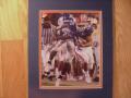 Picture: Tim Tebow runs Florida Gators original 8 X10 photo professionally double matted to 11 X 14 to fit a standard frame.
