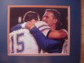 Picture: Tim Tebow and Urban Meyer embrace after their second Florida Gators National Championship 8 X 10 photo professionally double matted in team colors to 11 X 14 so that it fits a standard frame.