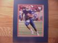Picture: Tim Tebow of the Florida Gators 8 X 10 photo professionally double matted in team colors to 11 X 14 so that it fits a standard frame.