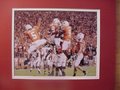Picture: The Texas Longhorns celebrate another great play 8 X 10 photo professionally double matted in team colors to 11 X 14 so that it fits a standard frame.
