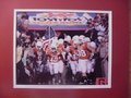 Picture: Texas Longhorns 2009 Tostitos Fiesta Bowl "Here Come the Longhorns" 8 X 10 photo professionally double matted in team colors to 11 X 14 so that it fits a standard frame.