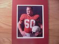 Picture: Tommy Nobis Texas Longhorns 8 X 10 photo professionally double matted in team colors to 11 X 14 so that it fits a standard frame.