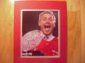 Picture: Jim Tressel of the Ohio State Buckeyes with the National Championship Trophy 8 X 10 photo professionally double matted to 11 X 14 so that it fits a standard frame.